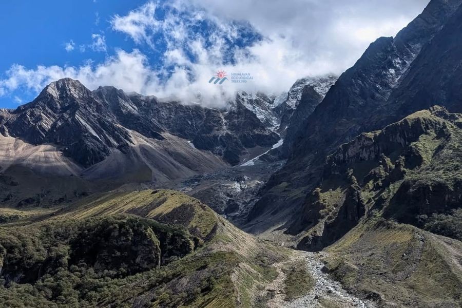 Dramatic mountain valley with glacier and rocky terrain in the Himalayas